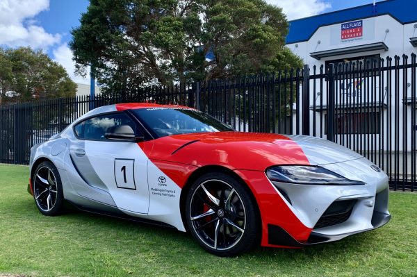 Vehicle Wrap on a Toyota GR Supra for Maddington Toyota out the front of the All Flags factory
