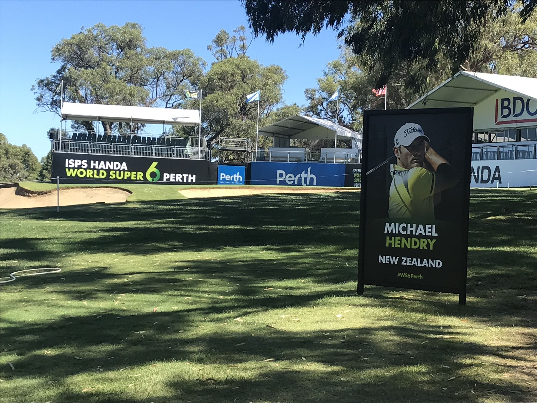Printed event signage, fence banners and an A-frame player sign installed at a Perth golf tournament