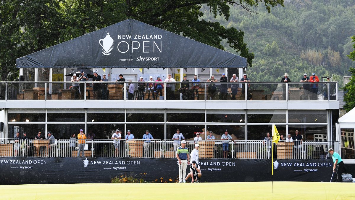 Printed event fence mesh and marquee branding installed around a tournament green
